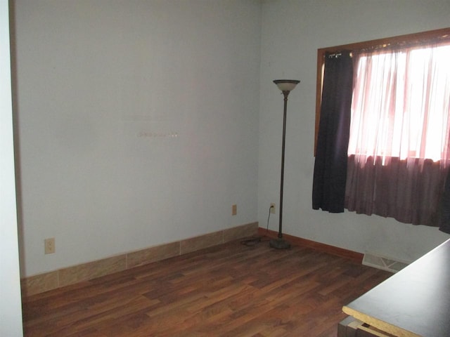 207 E Water St, Montello, WI 53949 - spare room featuring wood finished floors and baseboards