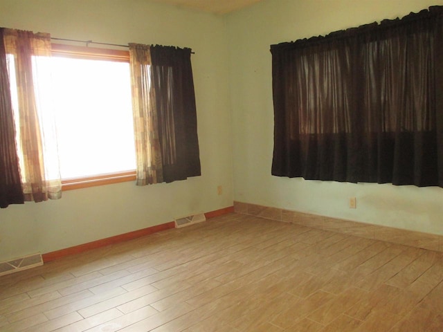 207 E Water St, Montello, WI 53949 - spare room featuring wood finished floors
