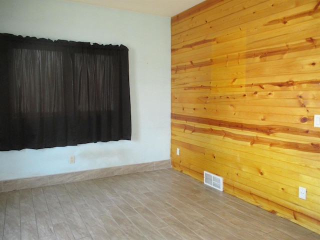 207 E Water St, Montello, WI 53949 - unfurnished room with wood walls and wood finished floors