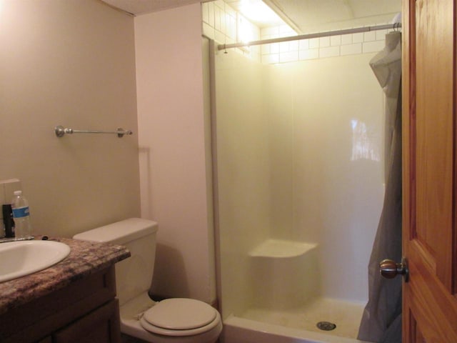 207 E Water St, Montello, WI 53949 - bathroom featuring a shower stall, toilet, and vanity