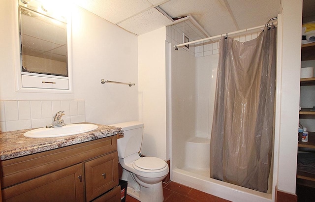207 E Water St, Montello, WI 53949 - bathroom with backsplash, toilet, a stall shower, vanity, and a drop ceiling