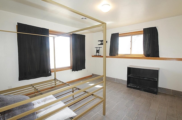 207 E Water St, Montello, WI 53949 - unfurnished bedroom featuring wood finished floors and baseboards