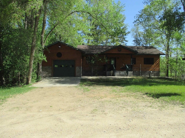 207 E Water St, Montello, WI 53949 - view of front of house featuring driveway and a garage