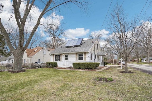 1301 Wyldhaven Ave, Monona, WI 53716 - view of property exterior with a yard, solar panels, and roof with shingles