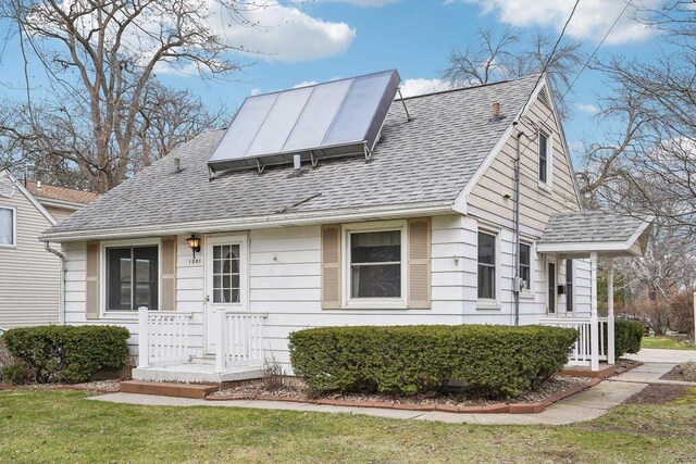 1301 Wyldhaven Ave, Monona, WI 53716 - view of front of property featuring roof with shingles and a front lawn