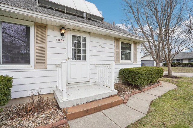 1301 Wyldhaven Ave, Monona, WI 53716 - entrance to property featuring a shingled roof