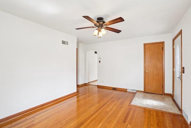 1301 Wyldhaven Ave, Monona, WI 53716 - empty room featuring visible vents, ceiling fan, light wood-style floors, and baseboards