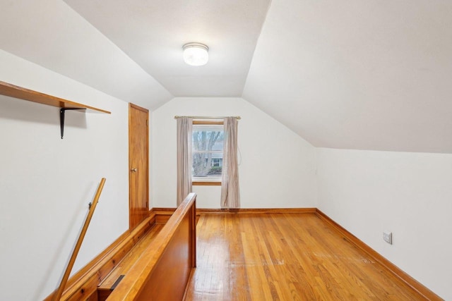 1301 Wyldhaven Ave, Monona, WI 53716 - additional living space featuring baseboards, light wood-type flooring, and lofted ceiling