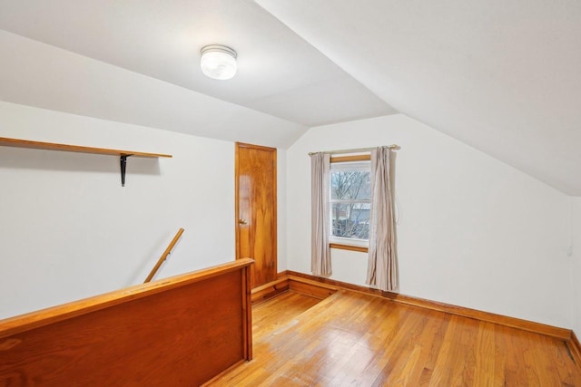 1301 Wyldhaven Ave, Monona, WI 53716 - bonus room featuring light wood finished floors, baseboards, and lofted ceiling