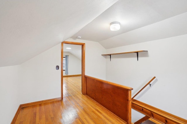 1301 Wyldhaven Ave, Monona, WI 53716 - bonus room featuring light wood finished floors, baseboards, and vaulted ceiling
