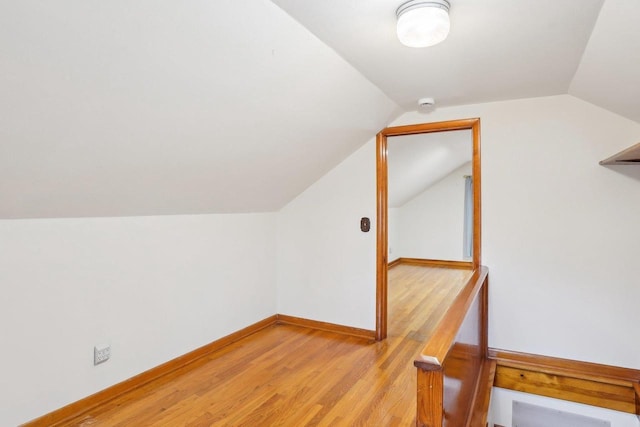 1301 Wyldhaven Ave, Monona, WI 53716 - bonus room with light wood finished floors, baseboards, and vaulted ceiling