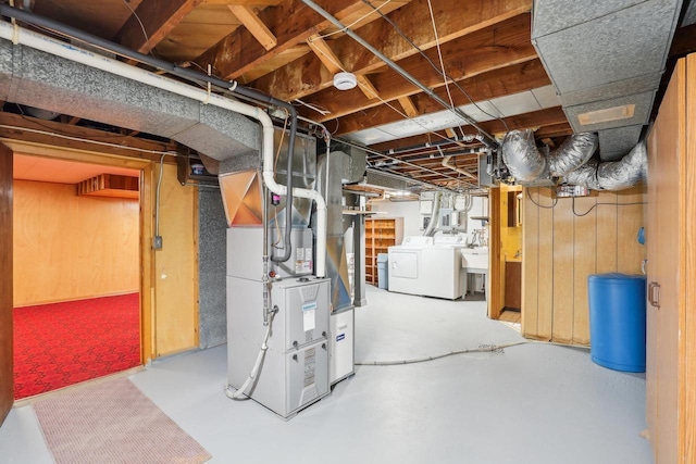 1301 Wyldhaven Ave, Monona, WI 53716 - unfinished below grade area featuring separate washer and dryer, wooden walls, and heating unit
