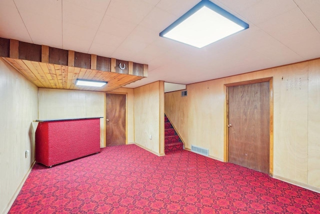 1301 Wyldhaven Ave, Monona, WI 53716 - finished below grade area with wooden walls, visible vents, and stairs