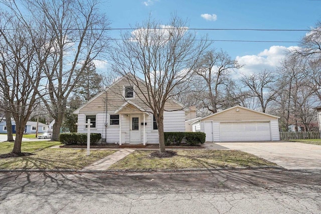 1301 Wyldhaven Ave, Monona, WI 53716 - view of front of house featuring an outbuilding, a detached garage, and fence