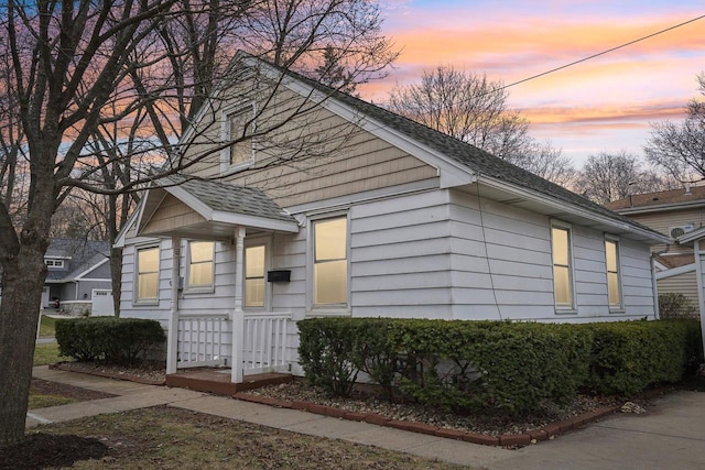 1301 Wyldhaven Ave, Monona, WI 53716 - view of home's exterior with a shingled roof
