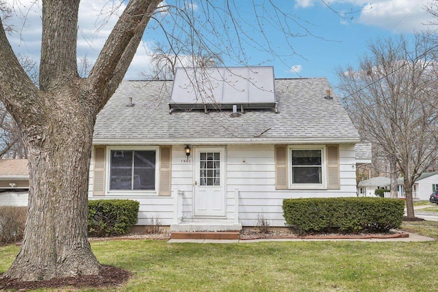1301 Wyldhaven Ave, Monona, WI 53716 - view of front of home featuring a shingled roof and a front lawn