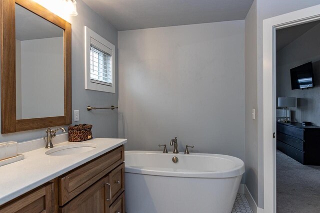 full bathroom with vanity and a soaking tub