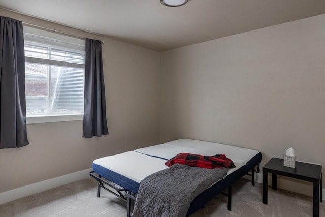 bedroom featuring carpet flooring and baseboards