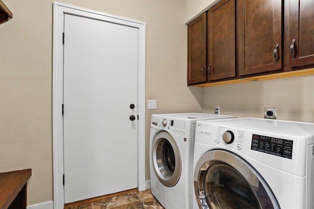 E12275 Timber Ridge Trl, Prairie Du Sac, WI 53578 - laundry area featuring cabinet space, washing machine and dryer, and stone finish floor