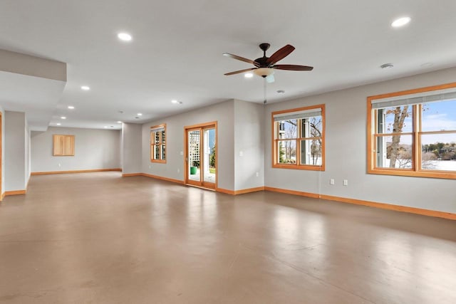 E12275 Timber Ridge Trl, Prairie Du Sac, WI 53578 - unfurnished living room featuring baseboards, recessed lighting, concrete floors, and a ceiling fan