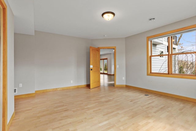 E12275 Timber Ridge Trl, Prairie Du Sac, WI 53578 - unfurnished room featuring light wood finished floors, baseboards, and visible vents