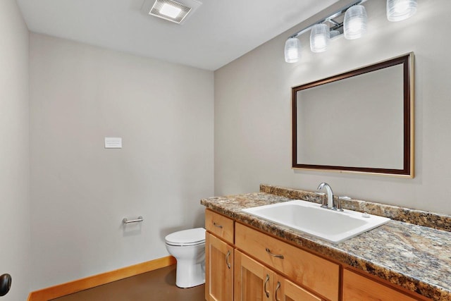 E12275 Timber Ridge Trl, Prairie Du Sac, WI 53578 - bathroom featuring toilet, visible vents, baseboards, and vanity