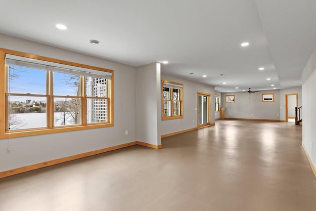E12275 Timber Ridge Trl, Prairie Du Sac, WI 53578 - spare room with baseboards, recessed lighting, finished concrete flooring, and ceiling fan