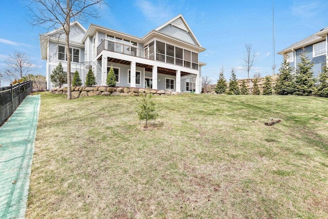 E12275 Timber Ridge Trl, Prairie Du Sac, WI 53578 - rear view of house with a lawn, a sunroom, and fence