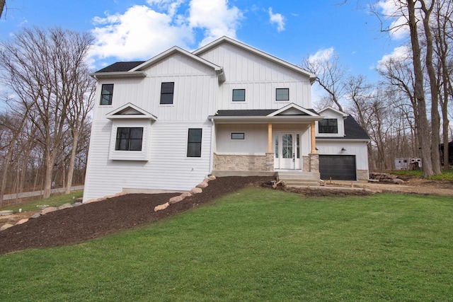 N2692 Forest Dr, Lake Geneva, WI 53147 - modern farmhouse style home with a front lawn, a garage, board and batten siding, and stone siding