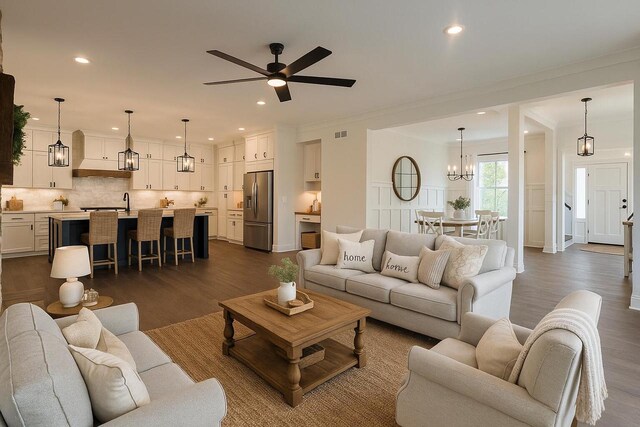 N2692 Forest Dr, Lake Geneva, WI 53147 - living area with dark wood-style flooring, a chandelier, a ceiling fan, ornamental molding, and recessed lighting