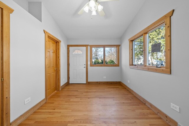 556 Highland Rd, Williams Bay, WI 53191 - foyer entrance with light wood-type flooring, baseboards, lofted ceiling, and ceiling fan