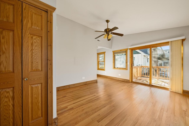 556 Highland Rd, Williams Bay, WI 53191 - spare room with light wood-type flooring, baseboards, ceiling fan, plenty of natural light, and vaulted ceiling
