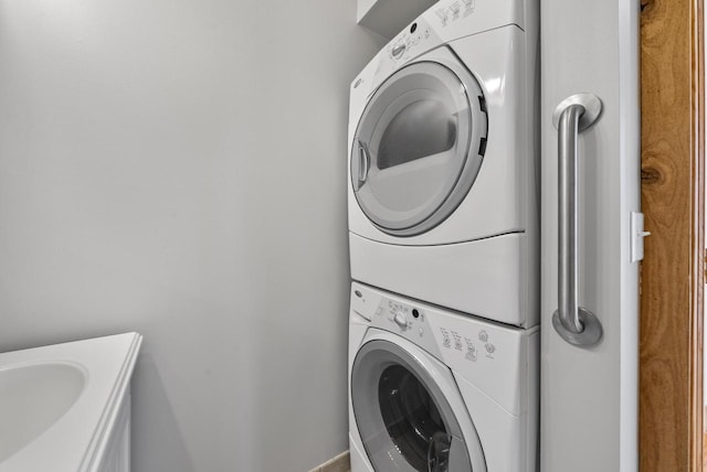 556 Highland Rd, Williams Bay, WI 53191 - washroom with stacked washer and clothes dryer