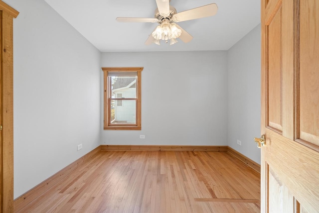 556 Highland Rd, Williams Bay, WI 53191 - empty room featuring light wood finished floors, baseboards, and ceiling fan