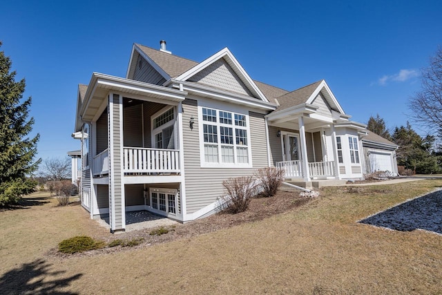 view of front facade with covered porch and a garage