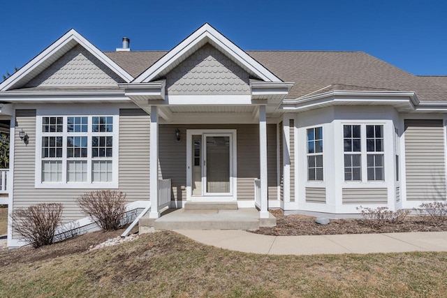 view of front of home featuring roof with shingles