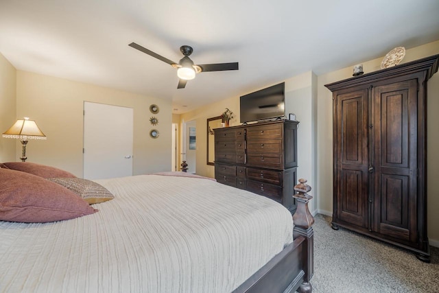 bedroom featuring baseboards, ceiling fan, and light colored carpet
