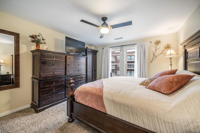 bedroom with baseboards, visible vents, ceiling fan, and carpet