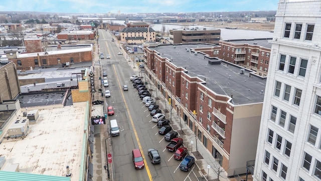 birds eye view of property featuring a water view and a view of city