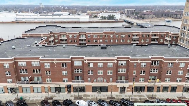 birds eye view of property featuring a water view