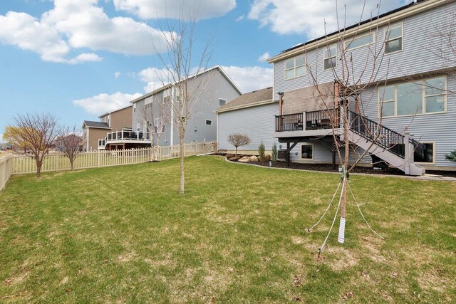 328 Venus Way, Madison, WI 53718 - back of house featuring a lawn, stairs, a fenced backyard, and a deck