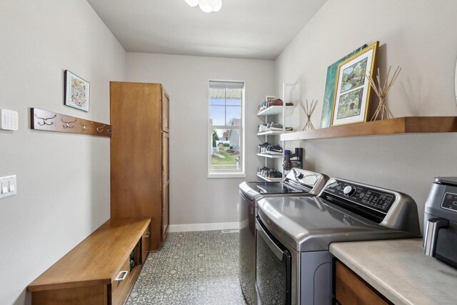 328 Venus Way, Madison, WI 53718 - laundry room with washer and clothes dryer, cabinet space, and baseboards