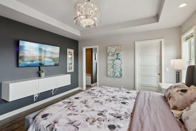 328 Venus Way, Madison, WI 53718 - bedroom featuring baseboards, an inviting chandelier, recessed lighting, and a raised ceiling