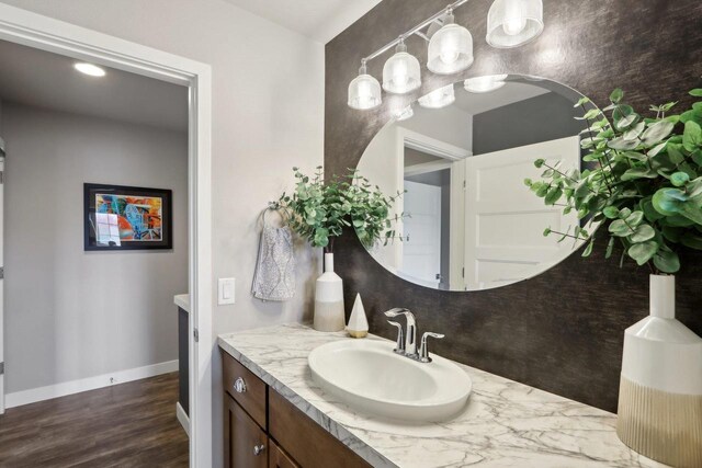 328 Venus Way, Madison, WI 53718 - bathroom with vanity, baseboards, and wood finished floors