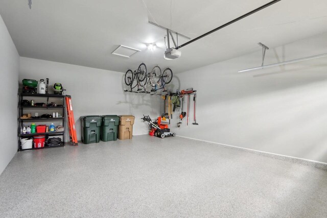 328 Venus Way, Madison, WI 53718 - garage featuring a garage door opener