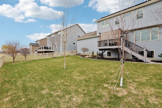 328 Venus Way, Madison, WI 53718 - back of property with a fenced backyard, a lawn, a wooden deck, and stairway
