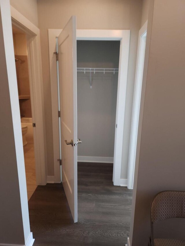 5684 N Kestrel Cir, Appleton, WI 54913 - hallway with baseboards and dark wood-style flooring