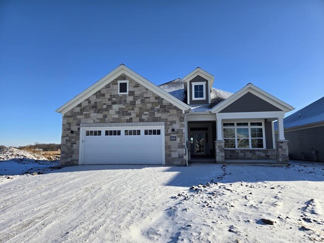 2544 E Baldeagle Dr, Appleton, WI 54913 - view of front of house featuring stone siding and an attached garage