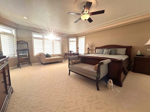 25621 Honeycut Ave, Tomah, WI 54660 - bedroom featuring ceiling fan, baseboards, light colored carpet, and a textured ceiling