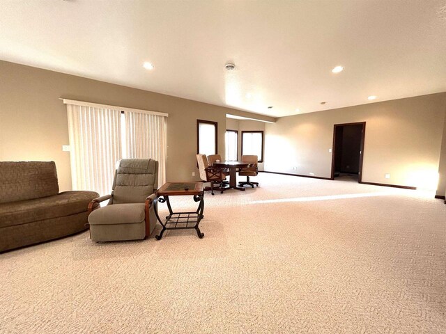 25621 Honeycut Ave, Tomah, WI 54660 - living room featuring baseboards, light colored carpet, and recessed lighting